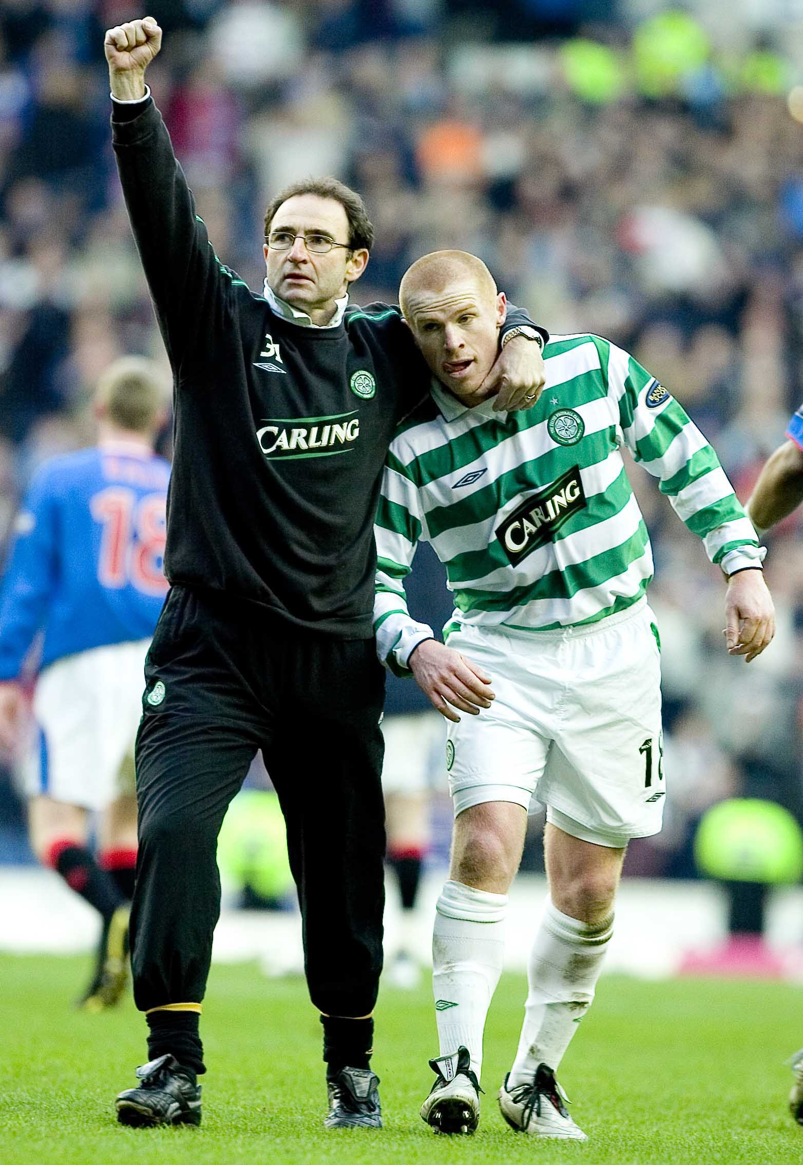 20/11/04 Spl .Rangers V Celtic (2-0).Ibrox - Glasgow .Celtic Manager Martin O'Neill (Left) Puts A Consoling Arm Around Neil Lennon As He Defiantly Salutes The Away Fans After Defeat.